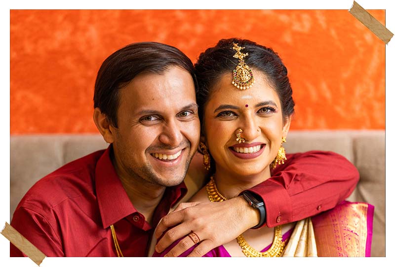 Snehal and Mihir smiling together in a candid wedding portrait, photographed by Bliss Memoir